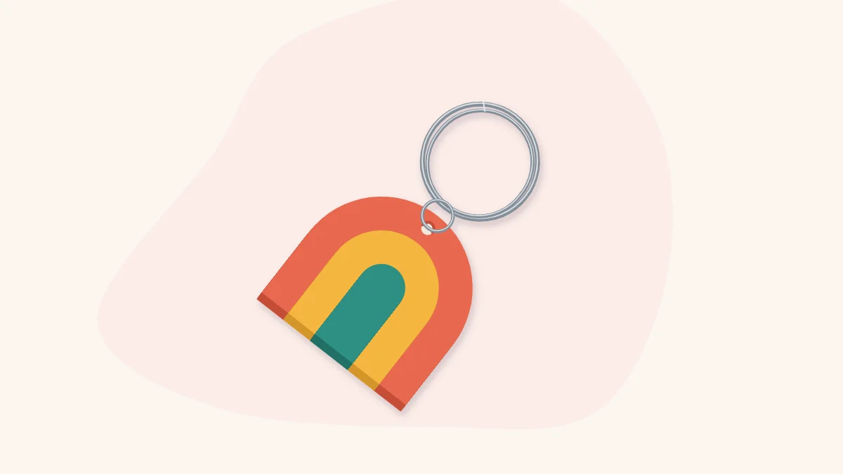 A layered arch-shaped polymer clay keychain attached to a split ring